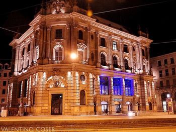 Low angle view of illuminated building at night