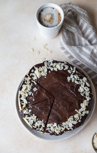 Delicious creamy cheesecake with chocolate glaze and almond. no bake mousse dessert. 
