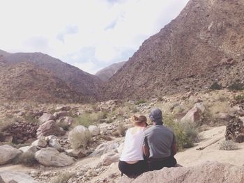 Man sitting on rock formation