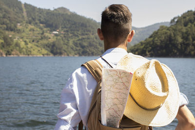 Traveler with backpack and map