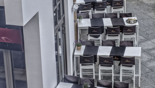 High angle view of chairs on table