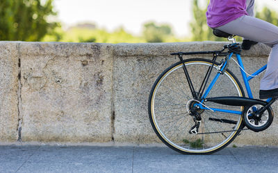 Low section of man riding bicycle