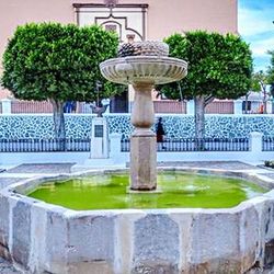 Fountain in front of building