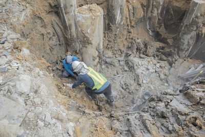 High angle view of working on rock