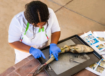 High angle view of woman working on table