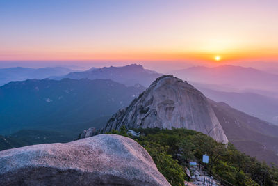 Scenic view of mountains against sky during sunset