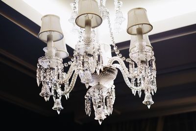 Low angle view of chandelier hanging from ceiling