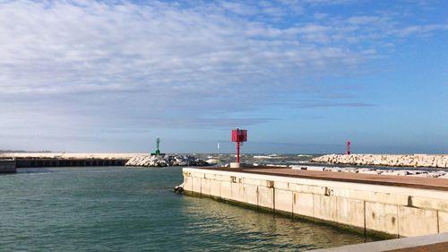 Pier over sea against sky