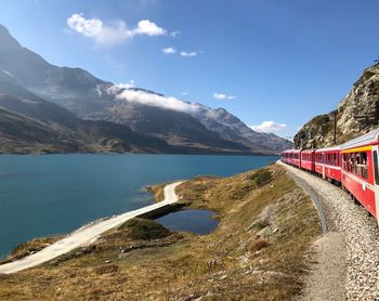 Scenic view of mountains and sea with railway 