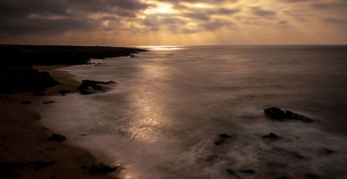 Scenic view of sea against sky during sunset