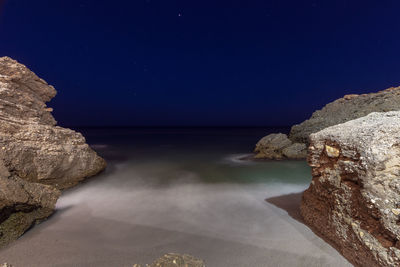 Scenic view of sea against sky at night