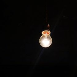 Low angle view of illuminated light bulb