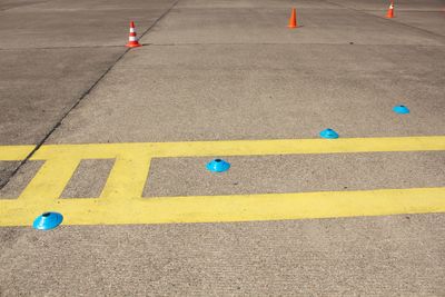 High angle view of arrow symbol on road