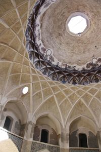 Low angle view of illuminated ceiling of building