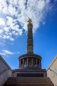 Low angle view of historical building against cloudy sky