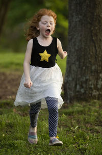 Full length of girl on field