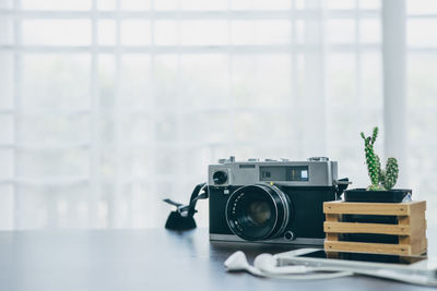 Close-up of camera on table