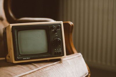 Front view of retro tv on the sofa