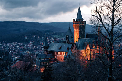 High angle view of buildings against sky at dusk