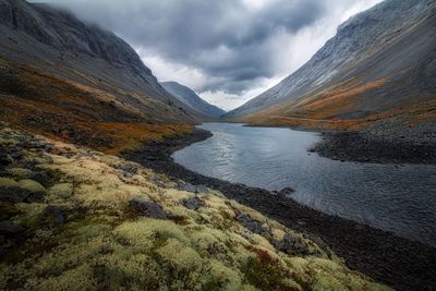 Scenic view of lake and mountains against sky