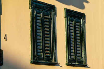 Low angle view of yellow window on building