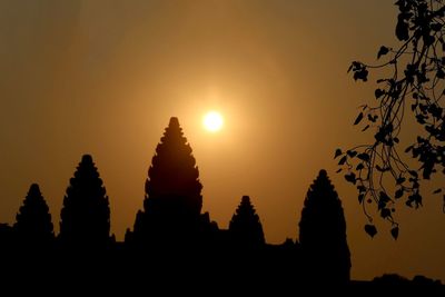 Silhouette temple against sky during sunset