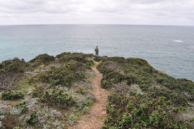 Scenic view of sea against cloudy sky