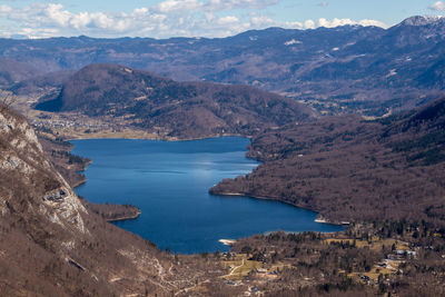 High angle view of sea and mountains against sky