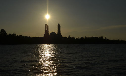 Silhouette of building at sunset