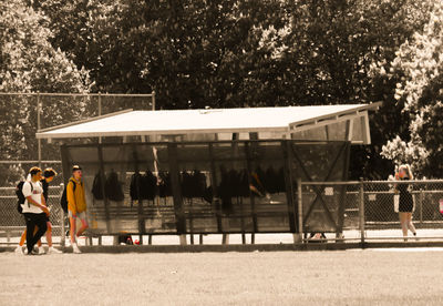 People walking in front of building