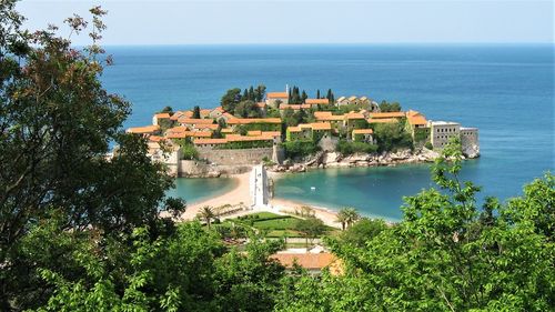 High angle view of buildings by sea