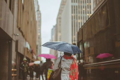 Rear view of woman walking in city