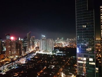 Aerial view of city lit up at night