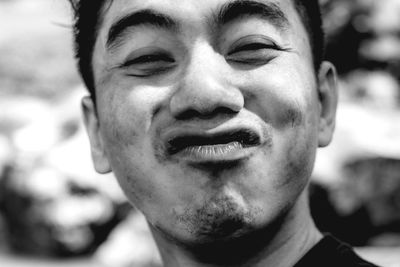 Close-up portrait of young man smiling