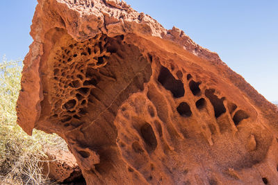 Low angle view of rock formation in desert against sky