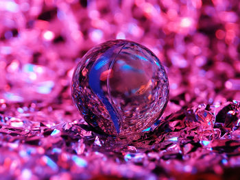 Close-up of crystal ball on glass