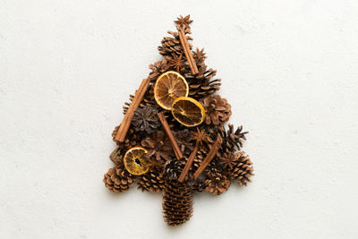 High angle view of christmas decorations on white wall