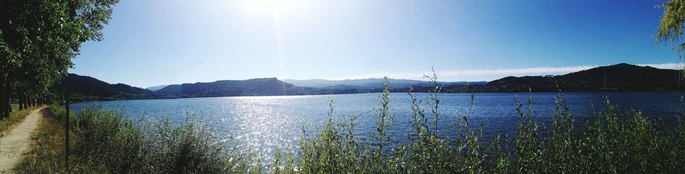 Scenic view of lake against blue sky