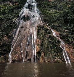 Panoramic view of waterfall in forest