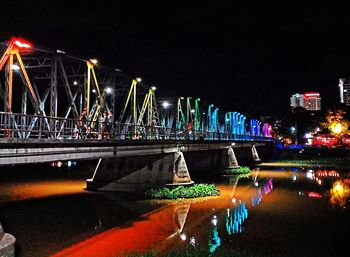 Bridge over river at night