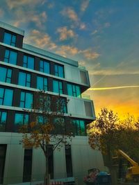 Low angle view of office building against sky