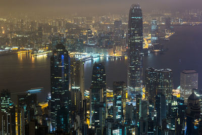 High angle view of illuminated city buildings at night