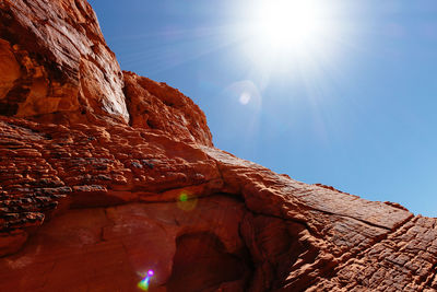 Low angle view of rock formation against sky