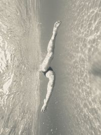 Woman swimming in sea