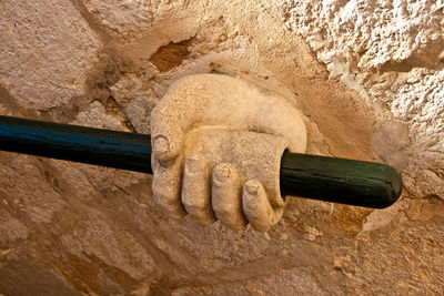 Close-up of old sculpture on rock
