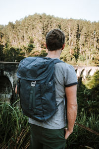 Rear view of man standing on field