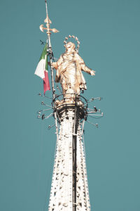 Low angle view of statue against clear blue sky