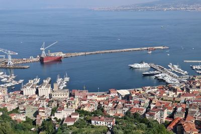 High angle view of harbor by buildings in city