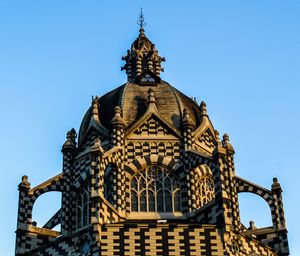 Low angle view of cathedral against blue sky