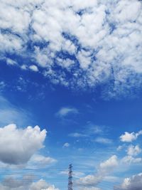 Low angle view of communications tower against sky